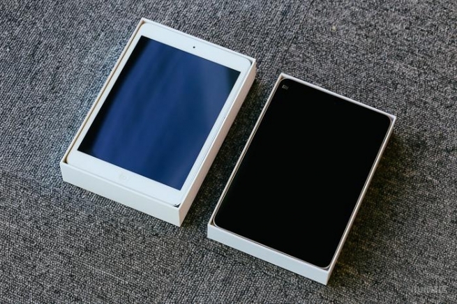 The full black one is the Mi Pad 2, The iPad Mini 2 is having White colour at its front side